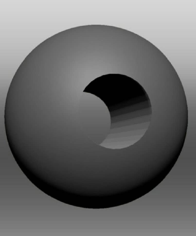 esfera gris con una perforacion en el centro 