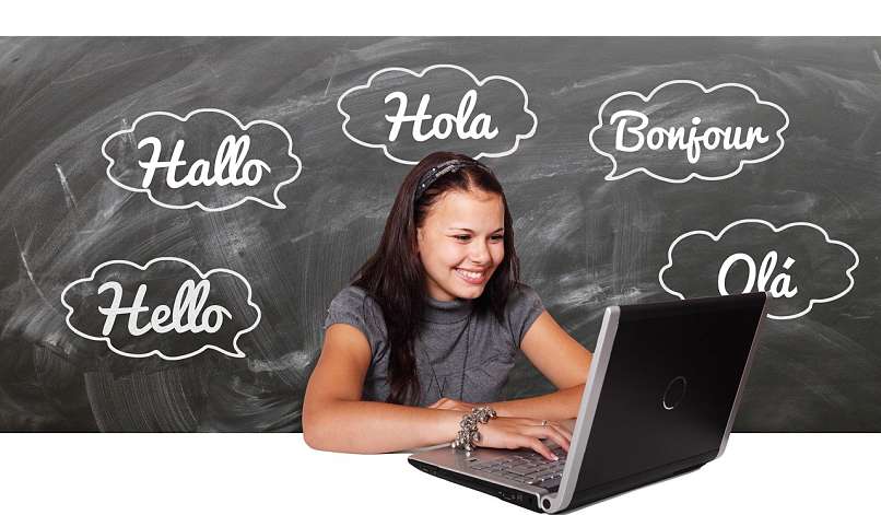woman with laptop and many languages