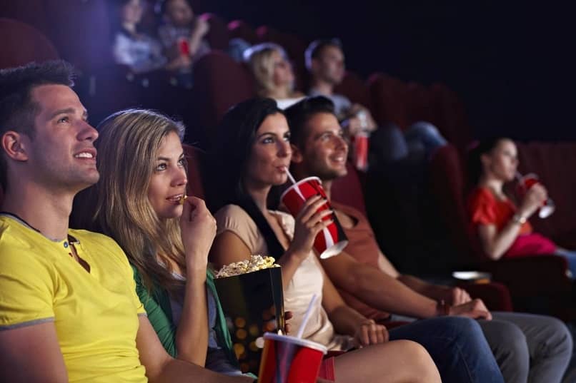 group of young people enjoying a movie